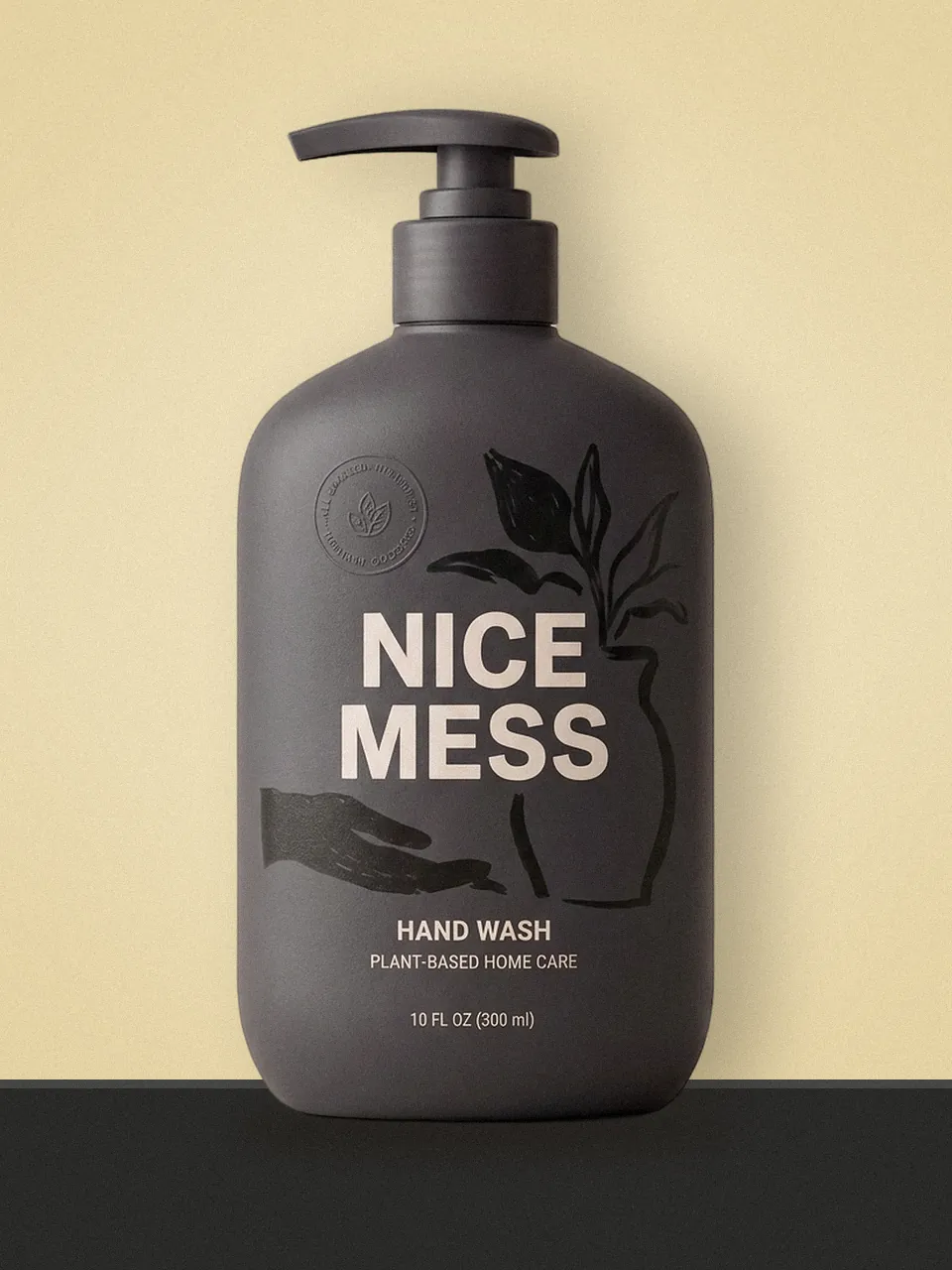 Charcoal Nice Mess Hand Wash 300 ml pump bottle on a colour-block shelf