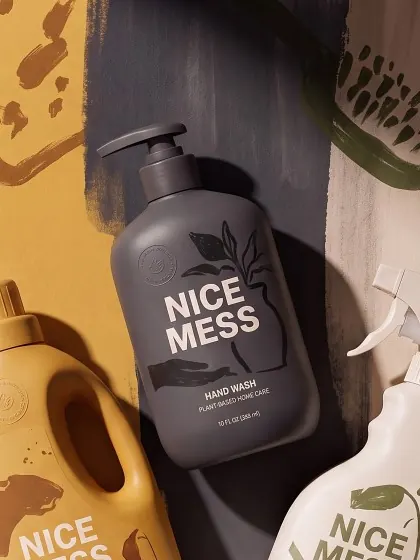 Hand Wash pump bottle lying on a charcoal painted backdrop